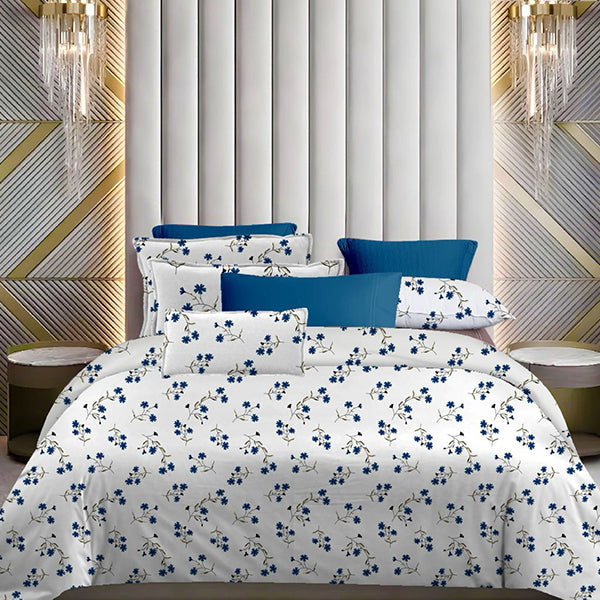 Floral bedding set with blue and white pattern on a bed in a stylish bedroom.