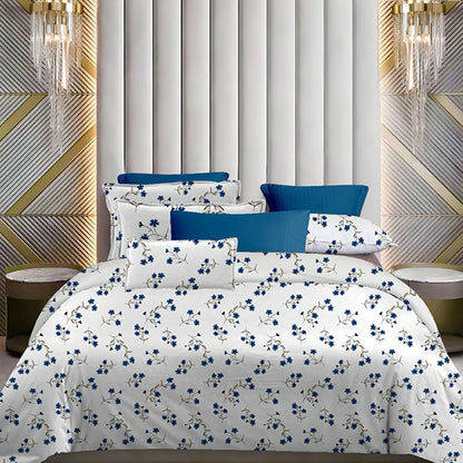 Floral bedding set with blue and white pattern on a bed in a stylish bedroom.