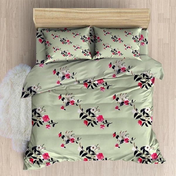 Floral patterned bedspread set on a wooden bed frame with a light background