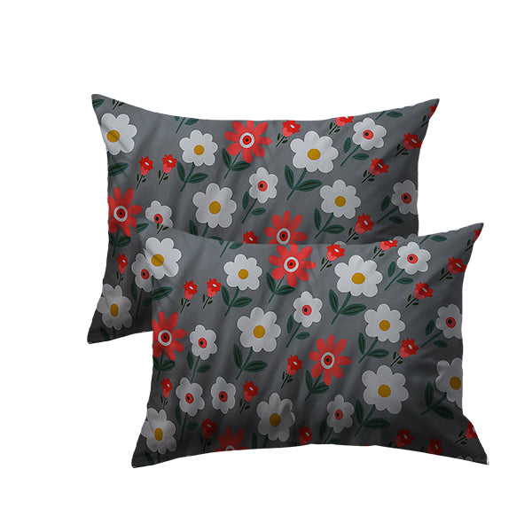 Two floral-patterned pillows on a white background