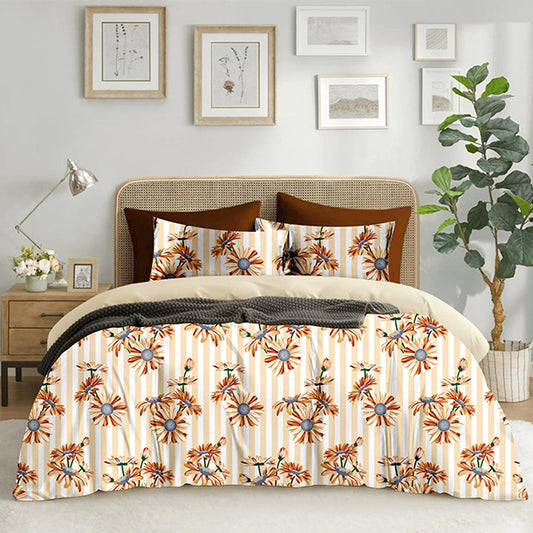 Floral patterned comforter on a bedding set in a bedroom.