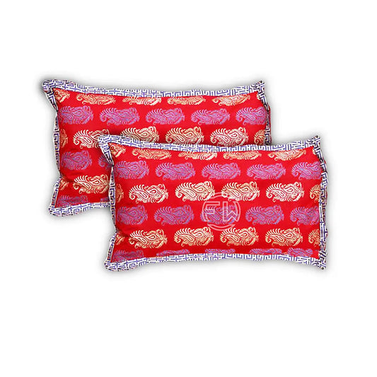 Two red pillows with white and orange patterns on a white background