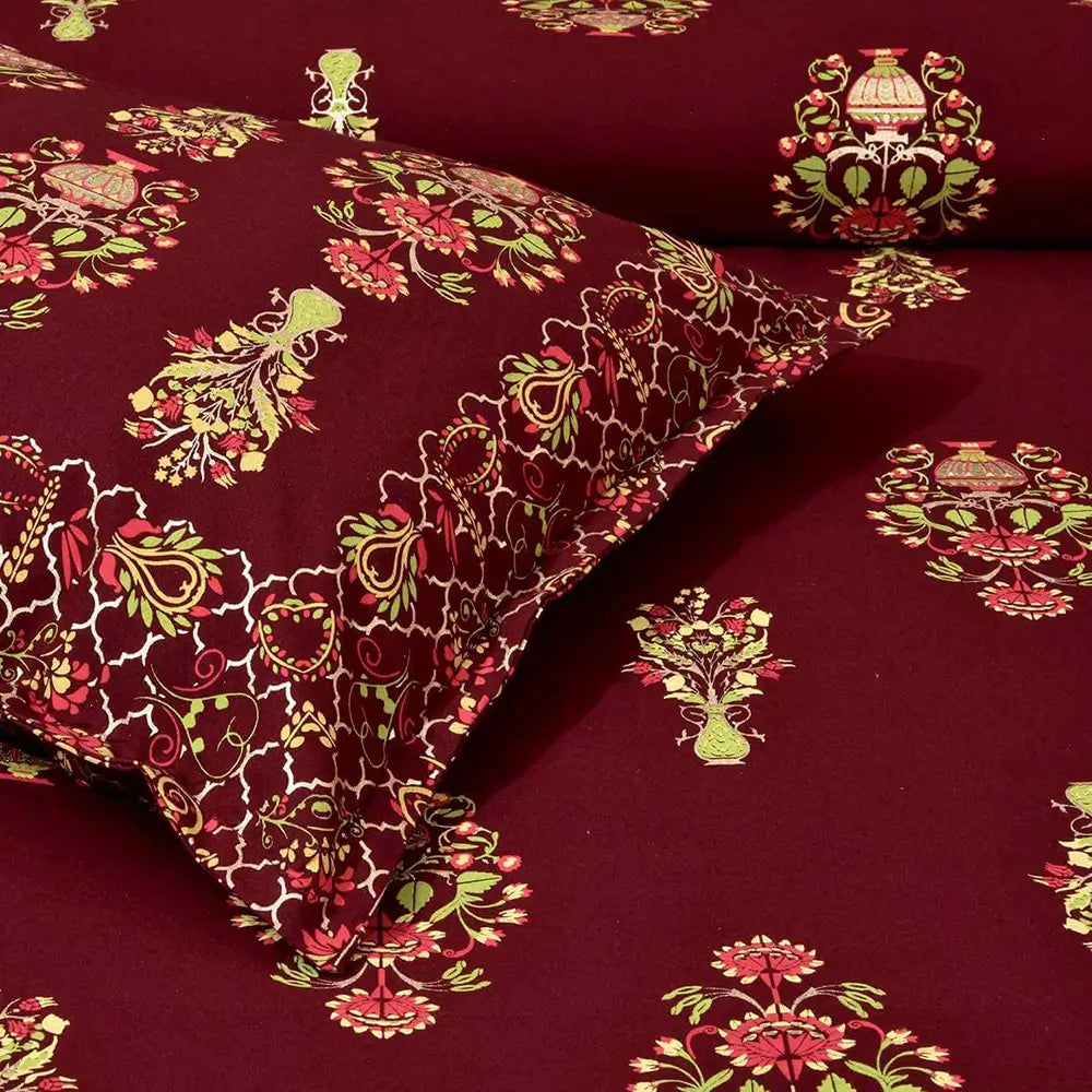 Red fabric with intricate floral and paisley patterns in green and pink - bedsheet