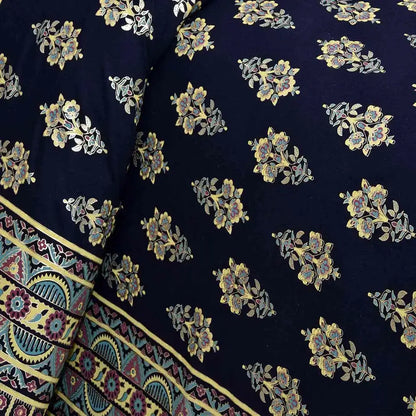 Bedsheet design - Navy blue fabric with floral patterns and a colorful border