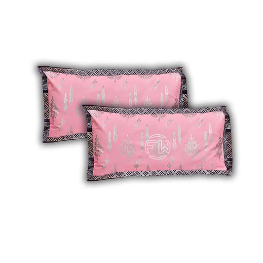 Two pink pillows with decorative patterns on a white background
