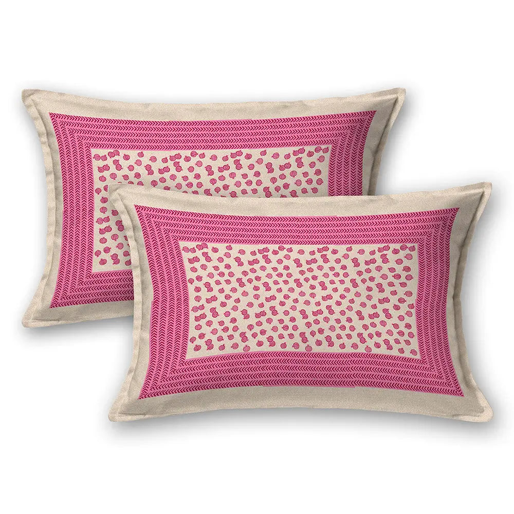Two pink and beige patterned pillows on a white background with doria print pink flower bedsheet
