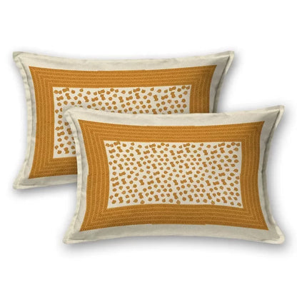 Two decorative pillows with a geometric pattern on a white background