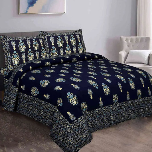 Navy blue floral patterned bedding set on a bed in a bedroom.