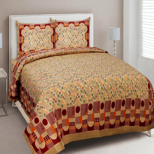 Bed with patterned bedding and matching pillows in a bedroom setting.