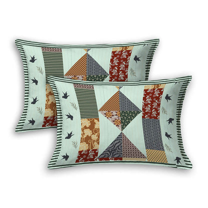 Two decorative pillows with patchwork patterns on a white background
