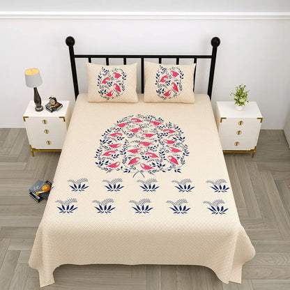 Beige jungle cruize brown bedspread with floral and bird pattern on a black metal bed frame in a bedroom setting.