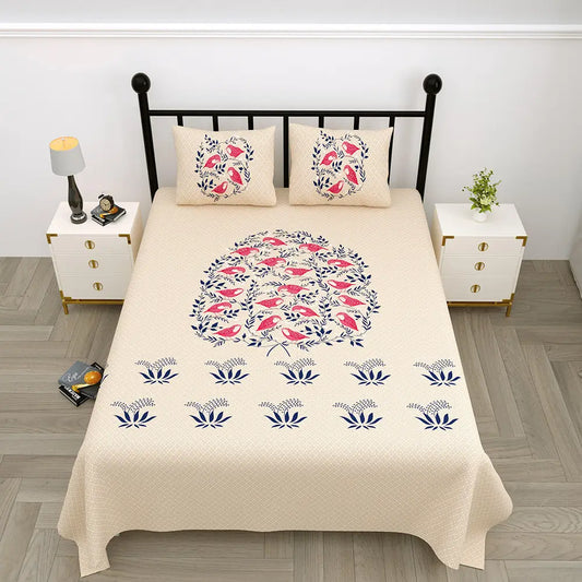 Beige jungle cruize brown bedspread with floral and bird pattern on a black metal bed frame in a bedroom setting.