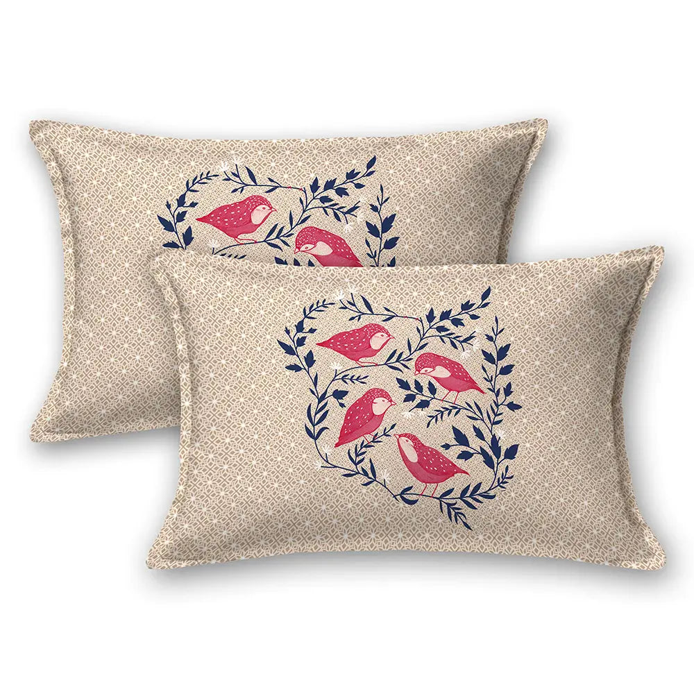 Two decorative pillows with bird and leaf pattern on a beige background with jungle cruize bedsheet