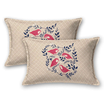 Two decorative pillows with bird and leaf pattern on a beige background with jungle cruize bedsheet