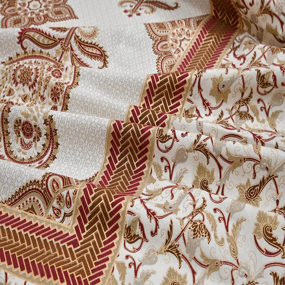 Close-up of patterned fabric with red and gold designs on a white background of a Big Floral Paisley White Jaipuri Gold Print Cotton Bedsheet 