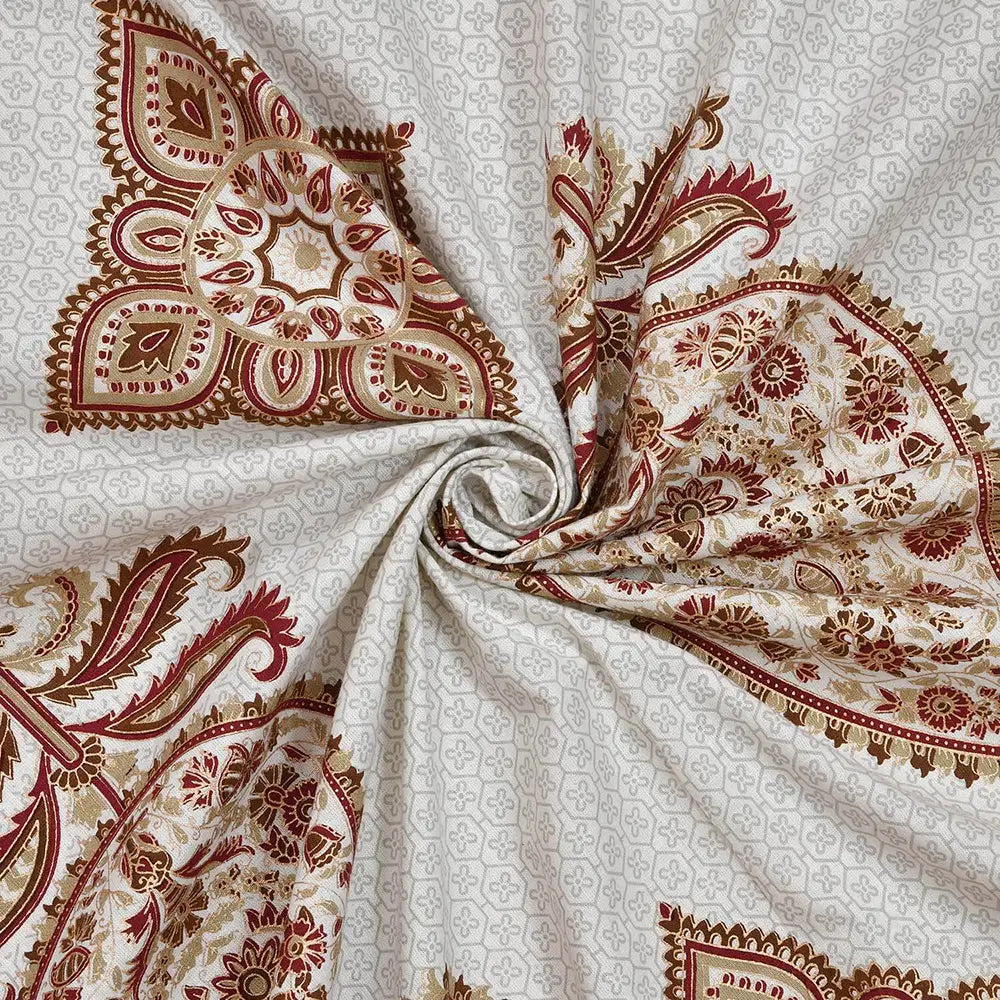 Close-up of patterned fabric with red and beige design on a white background